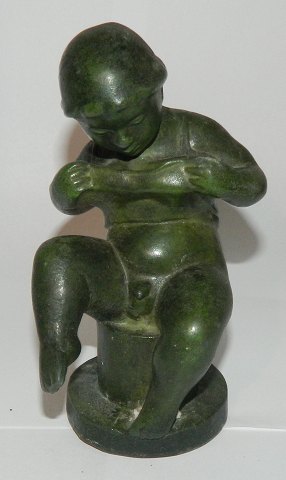 Figure of naked boy from the 1930s