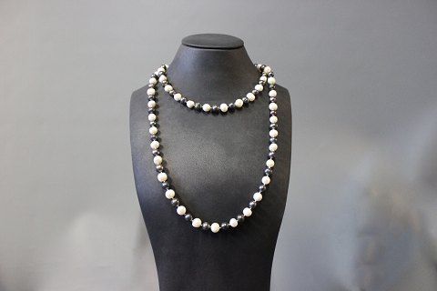 Long necklace consisting of fresh Water Pearls and bloodstones.
5000m2 showroom.