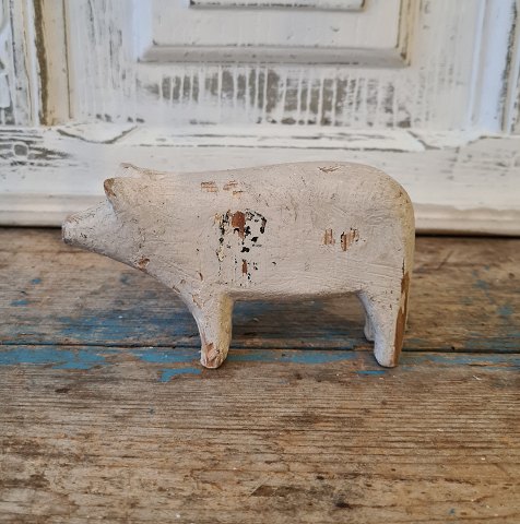 Old prison toys in the form of gray-painted pig
