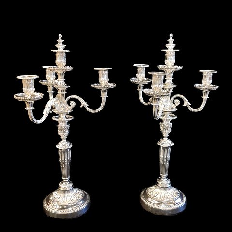 A pair of French three armed  candlesticks in silver plated bronze
