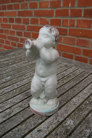 Michael Andersen Danish pottery, Bornholm. Naked boy with trumpet, and a chip on 
the low plinth