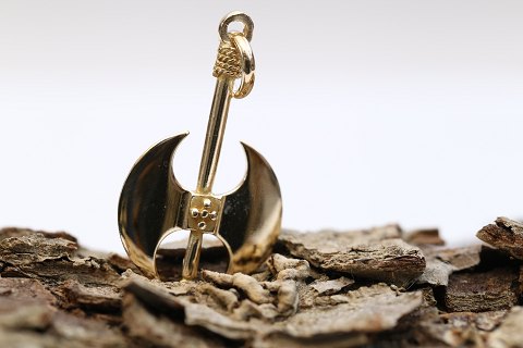 Pendant in 14 carat gold, designed as an axe. Very detailed and beautiful. 
Stamped 585