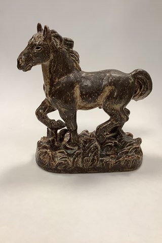 Royal Copenhagen Stoneware figurine of a Horse No 21735
Measures 32cm x 26cm / 12.60 inch x 10.24 inch
Designed by Knud Kyhn
