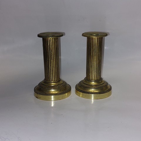 Pair of Empire candlesticks in brass
