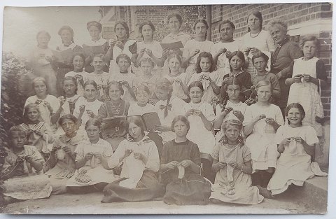 Photo postcard: The girls show their acquired skills in a class photo