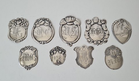 Lot of 9 coat shield in silver