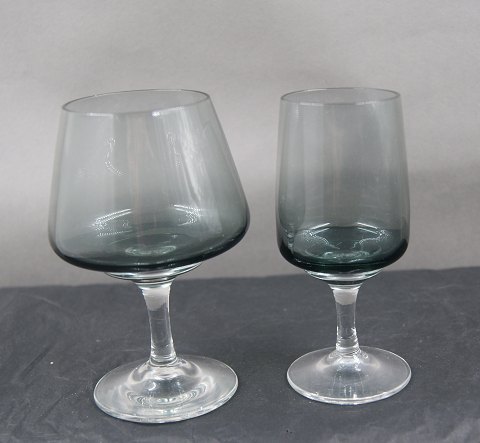 Atlantic smoke-coloured glassware by Holmegaard, Denmark. Brandy glasses 11.5cm 
and tall port wine 11cm