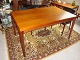 Dining table in teak with Dutch leaves. Designed by Henning Kjærnulf.
5000m2 showroom.
