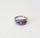 Art Deco ring i 18 kt hvidguld besat med talrige diamanter og rubiner