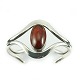 Niels Erik From; 
A bangle in sterling silver with amber