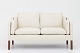 Børge Mogensen / Fredericia Furniture
BM 2212 - Reupholstered 2-seater sofa in Paris Cream leather w. legs in 
mahogany. KLASSIK offers upholstery of the BM 2212 in fabric or leather of your 
choice.
Availability: 6-8 weeks
Renovated
