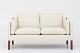 Børge Mogensen / Fredericia Furniture
BM 2212 - Reupholstered 2-seater sofa in Paris Cream leather w. legs in 
mahogany. KLASSIK offers upholstery of the BM 2212 in fabric or leather of your 
choice.
Availability: 6-8 weeks
Renovated
