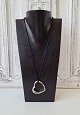 Georg Jensen big heart in silver with silk cord.