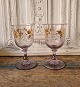 Beautiful French wedding glass, in glass with purple tone, decorated with leaves 
in gold 19.5 cm.
