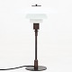Poul Henningsen / Louis Poulsen
PH 4/3 - Table lamp in browned brass w. white opal glass shades. Marked 
