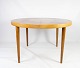 Dining table in 
light wood with two extension plates, designed by Omann Junior  from the 1960s. 

5000m2 showroom.
