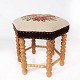 Stool of light wood and upholstered with embroidered fabric from the 1970s.
5000m2 showroom.