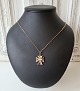 Cross with 60 cm. chain in 14 kt gold.