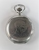 Double capsulated silver pocket watch. JWC. Front: Emperor Franz Joseph. Back: 
Austrian double eagle. Diameter 50 mm. Clockwork is ok. K.u.K Hofuhrmacher, 
Friedrich Baumann Wien