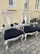 Pair of Swedish chairs from the beginning of the 20th century in baroque / 
rococo style. White painted wood and chair seats upholstered in black fabric