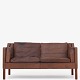 Børge Mogensen / Fredericia Furniture
BM 2212 - 2 seater sofa in patinated brown leather on teak legs.
Vidste du, at BM 2212-sofaen (1962) blev tegnet til arkitektens eget hjem? 
Sofaen fås i flere varianter.
1 pc. in stock
Good condition
