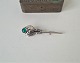 Art Nouveau brooch in silver with green stone