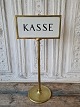 Large brass sign The sign originates from a bank.