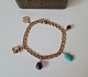 Vintage Bismarck bracelet with 5 charms in 14 kt gold