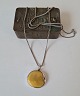 Long necklace in silver with large amber pendant