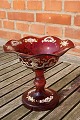 Bohemian glass.
Ruby red centerpiece or candy bowl on high stand with nice decoration