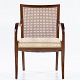 Frits Hennningsen / Frits Henningsen
Rare mahogany armchair with curved arms, back in patinated French wicker and 
seat in light-coloured textile.
3 pcs. på lager
Good, used condition
