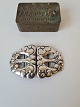 Silver belt buckle