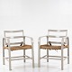 Magnus Stephensen / Snedkermester Clausen
Pair of easy chairs in grey painted wood with patinated seat of paper yarn and 
back with tilt function. Ca. 1933.
1 pc. in stock
Good, used condition
