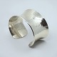 Regitze Overgaard for Georg Jensen; Smithy Cuffs bangle in hammered sterling 
silver No. 566B