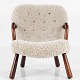 Arnold Madsen / Schubell & Madsen
Early, original shell chair in stained beech with new lambskin and leather 
buttons.
1 pc. in stock
Reupholstered
