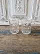 Water glass decorated with moon and stars made of pressed glass