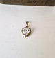 Pendant in 8 kt gold shaped like a heart with a heart-shaped cut clear stone