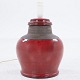 Niels Kähler / Kähler
Table lamp in stoneware with deep red glaze and unglazed dark details.
A shade is not included with the lamp, but is available for purchase. Please 
contact us for more information.
1 pc. in stock
Original condition
