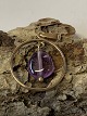 Pendant in 8 carat gold, with inlaid amethyst.