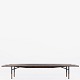 Finn Juhl / Bovirke.
Model BO 101 - Rare table bench in Brazilian rosewood with mouldings in 
patinated brass and frame in anodised metal. Designed in 1953.
1 pc. in stock
