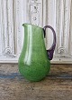 Kosta Boda jug in grass green glass with twisted purple handle