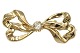 14 Carat gold
Small bow brooch with a clear stone