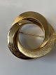 14 Karat guld broche 
Diameter  3,6 cm.