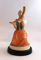 Royal Copenhagen. Pigen med guldhornet. Model 12242. Højde 21 cm. (1 sortering)
