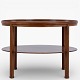 Kaare Klint / Rud. Rasmussen.Round coffee table in patinated mahogany with underlying shelf. Manufacturer