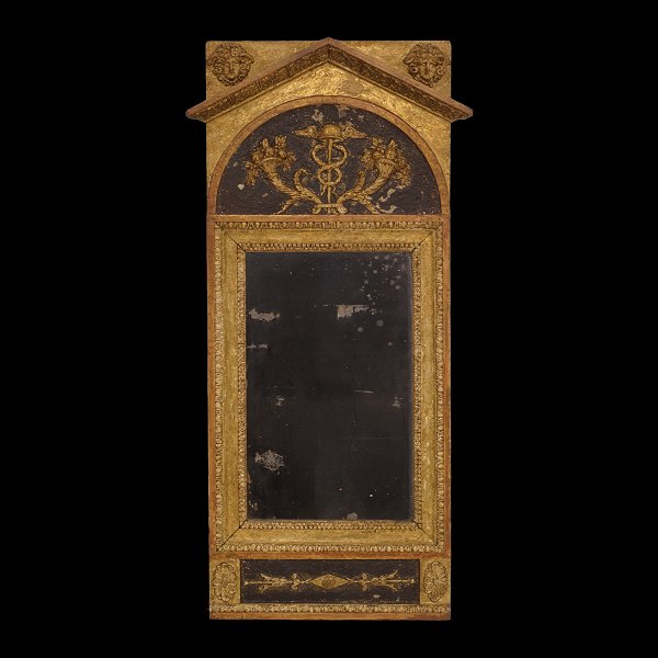 An early 19th century partly gilt late Guastvian mirror. Sweden circa 1800. 
Size: 91x39cm