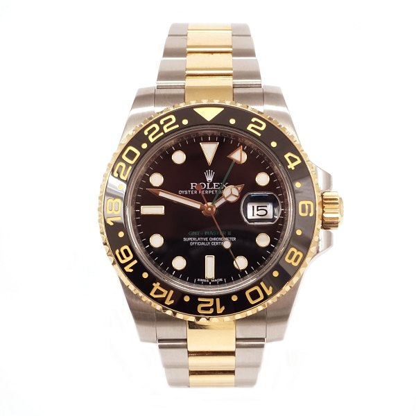 Rolex GMT Master II 18 kt gold and steel. Box and papers. Year 2014