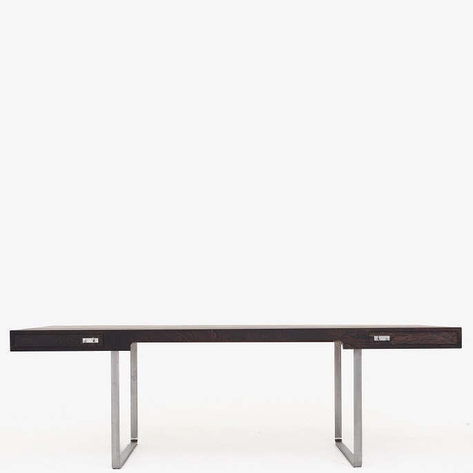 Hans J. Wegner / Johannes Hansen
JH 810 - Freestanding desk with wengé top. Front with two drawers, frame and 
handle in matt chromed steel. Designed in 1970.
1 pc. in stock
Good condition
