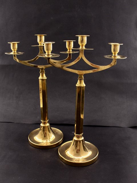 A pair of 3-armed brass candlesticks