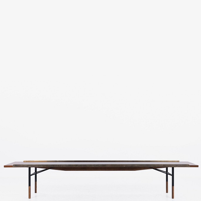 Finn Juhl / Bovirke.
Model BO 101 - Rare table bench in Brazilian rosewood with mouldings in 
patinated brass and frame in anodised metal. Designed in 1953.
1 pc. in stock
